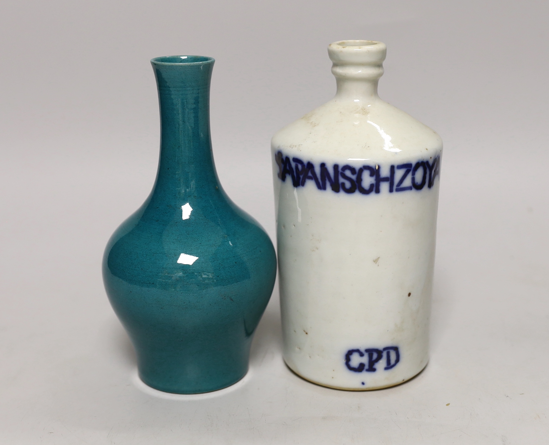 A Chinese green monochrome vase and a flask, tallest 17cm